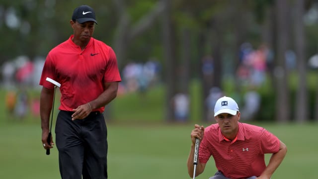 Tiger Woods watches as Jordan Spieth lines up his putt on hole No.1. The Final Round of The Players Championship at TPC Sawgrass Players Stadium Course in Ponte Vedra Beach, FL on Sunday May 13, 2018. (Bob Self/Florida Times-Union) Fl Jax 05playersfin